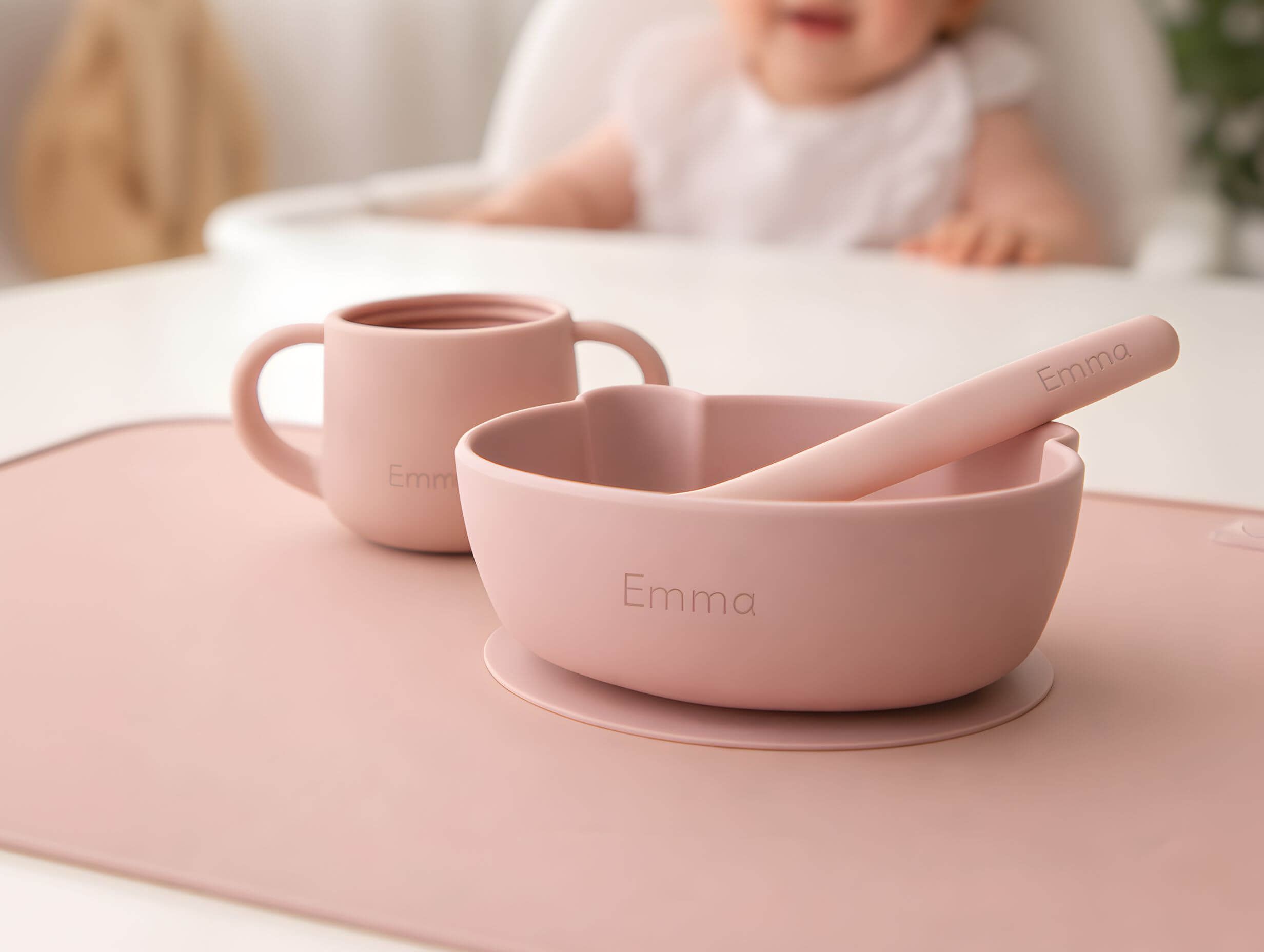 Close-up of engraved baby name on a bowl and spoon from the First Bites Gift Set.